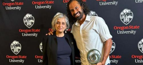 Bahman Abbasi and President Murthy posing for a 2023 faculty award at Oregon State University